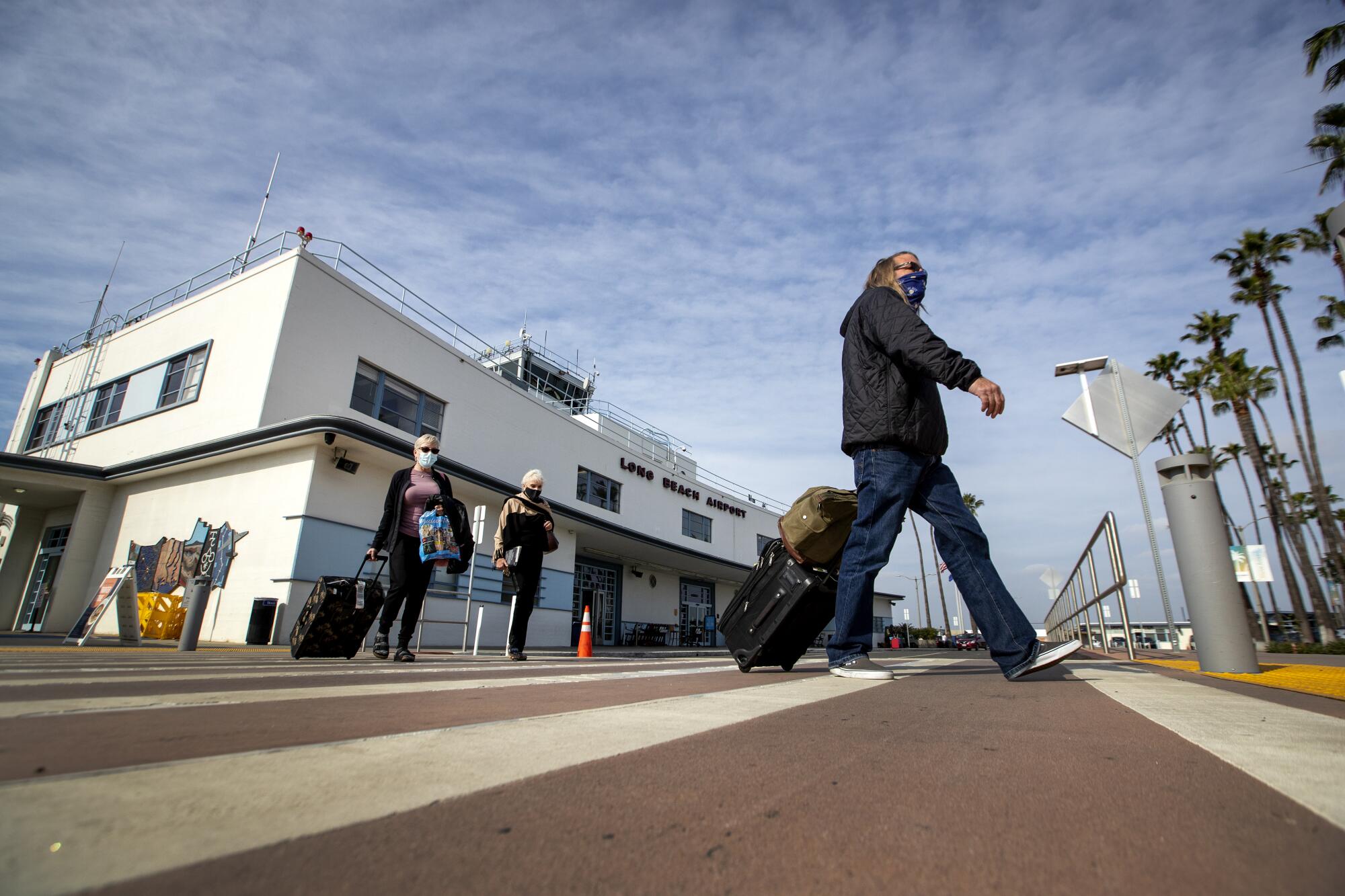 Travelers arrive at Long Beach Airport.