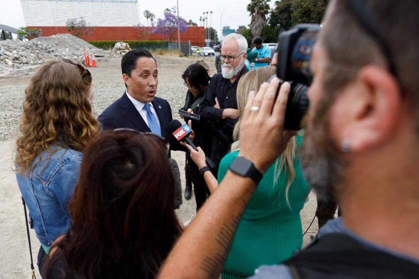 Mayor Todd Gloria speaks to members of the media about the future safe parking lot for homeless people after a press conference at the former H Barracks site in San Diego on Thursday, June 6, 2024.