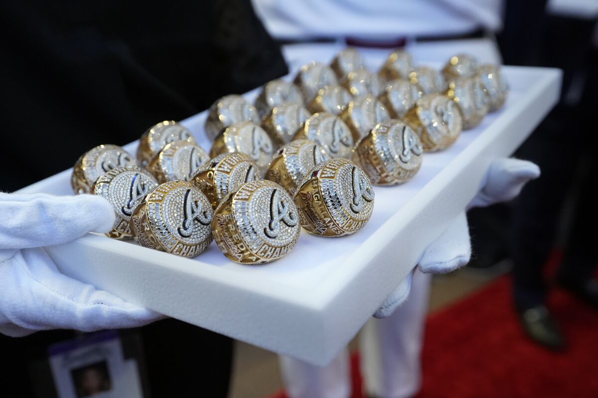 Atlanta Braves World Series rings are collected after a ceremony.