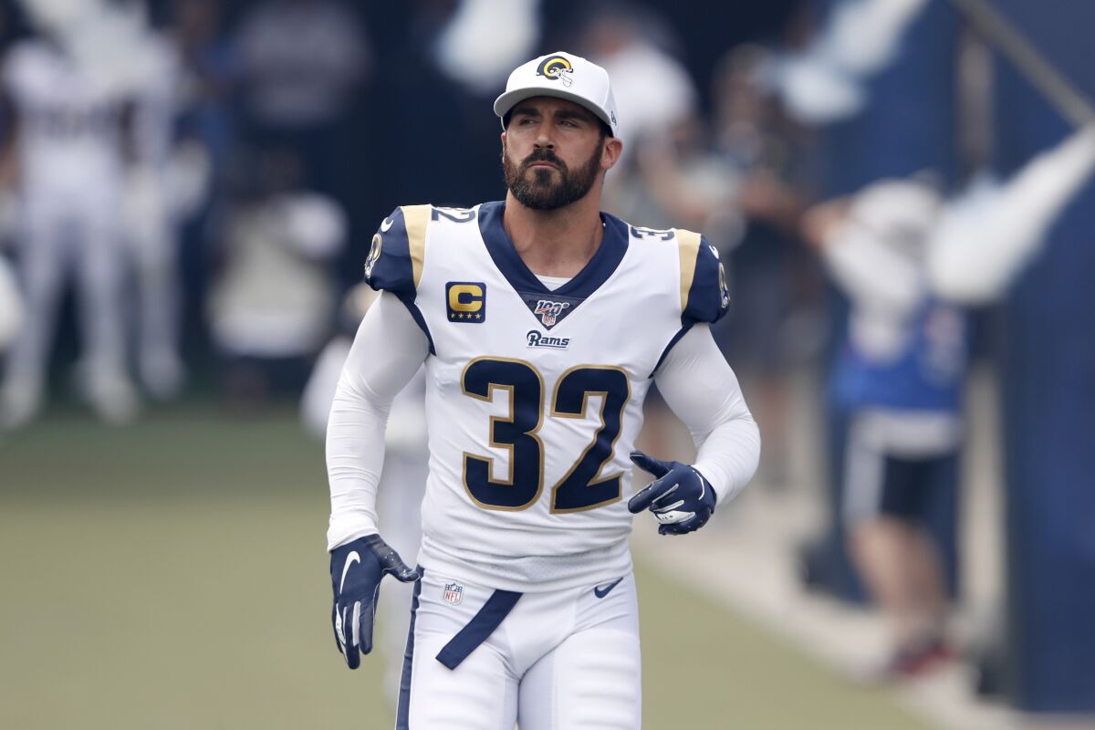 Rams safety Eric Weddle runs onto the field before a game.