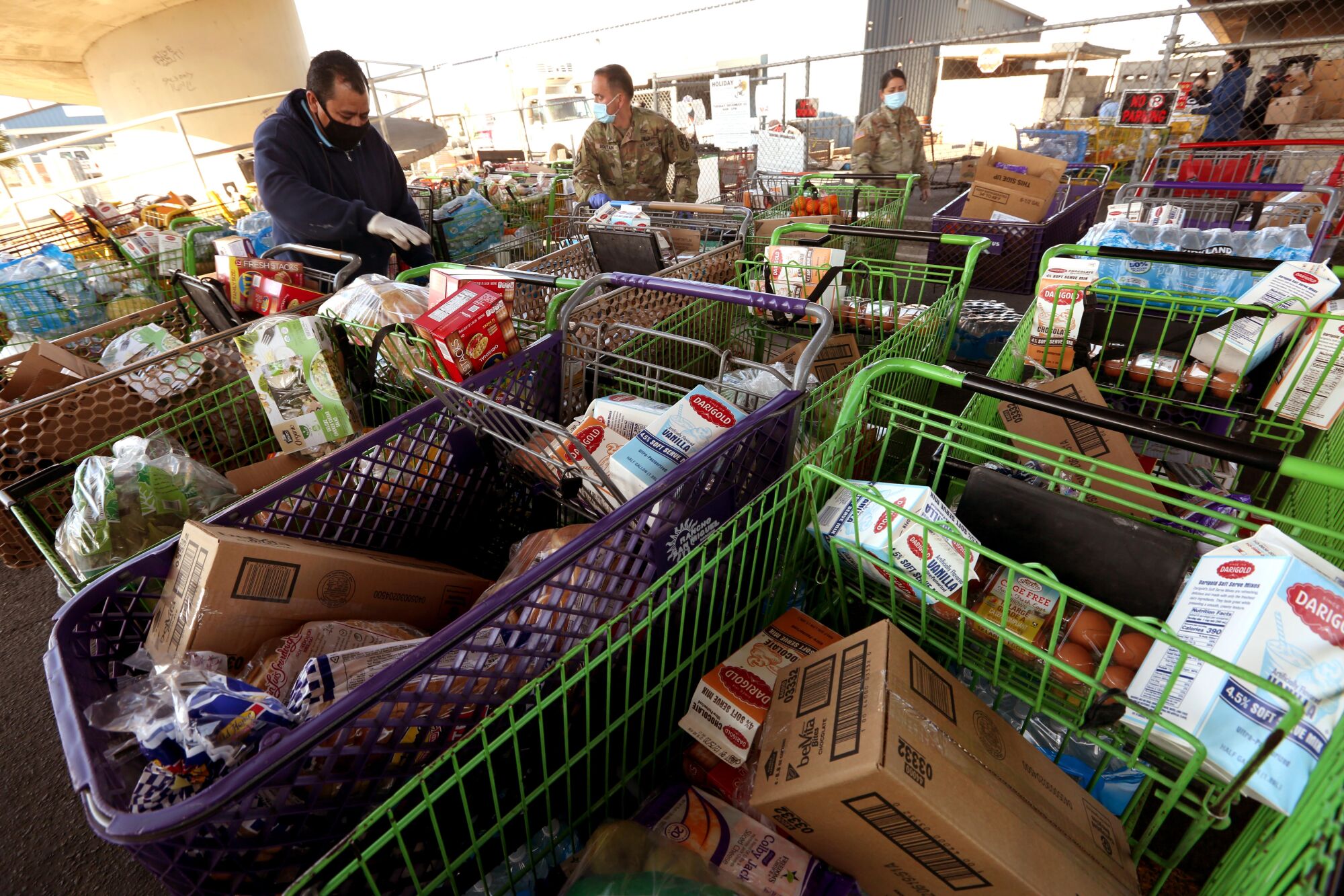 Volunteers with the Emergency Food Bank deliver food to needy families in Stockton.