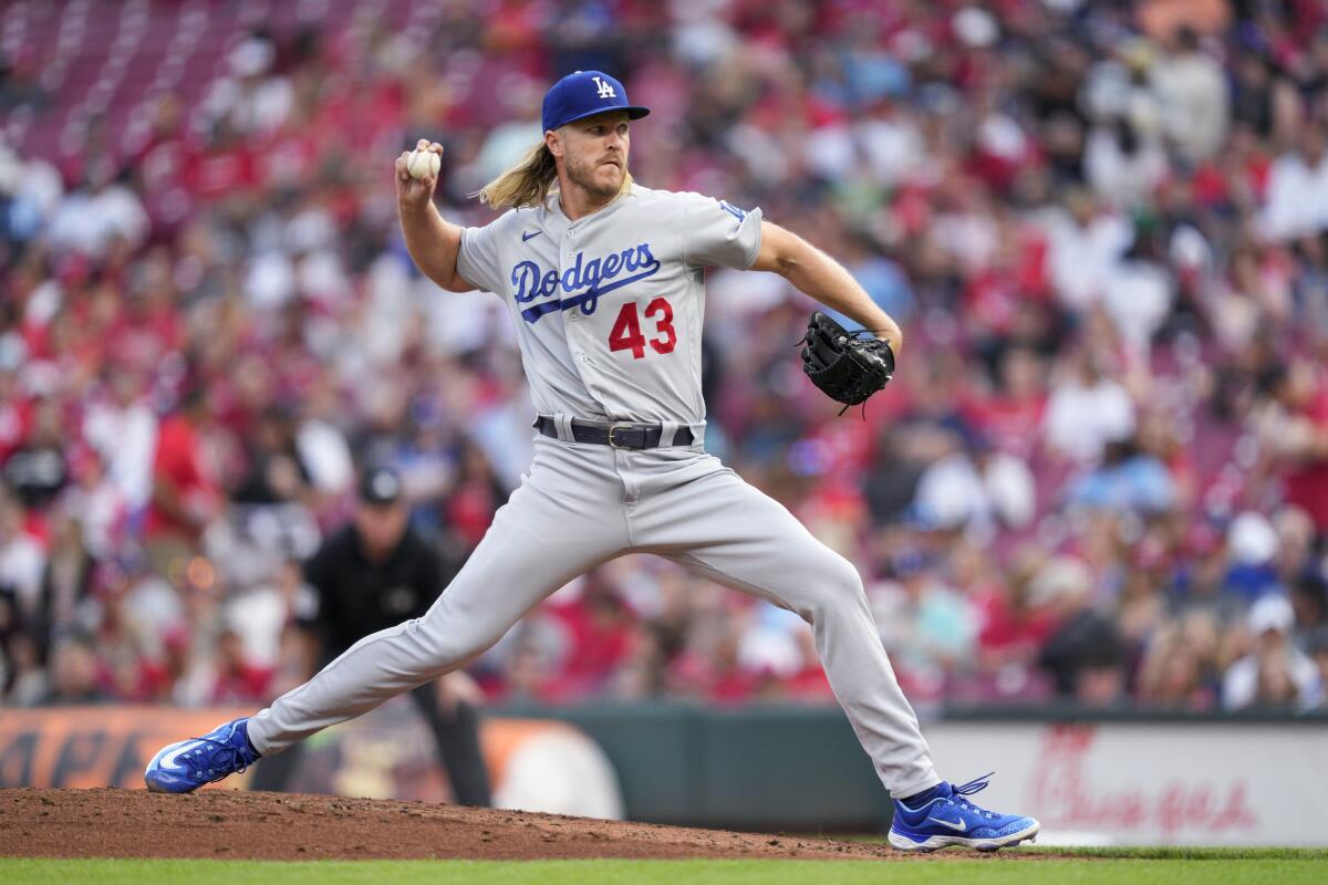 Dodgers starting pitcher Noah Syndergaard delivers to the Reds.