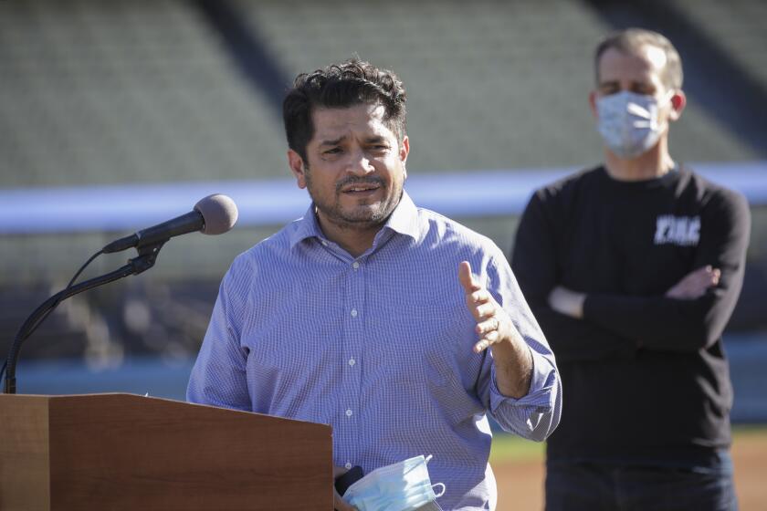 Los Angeles, CA - January 15: Congressman Jimmy Gomez addresses a press conference held at the launch of mass COVID-19 vaccination site at Dodger Stadium on Friday, Jan. 15, 2021 in Los Angeles, CA. (Irfan Khan / Los Angeles Times)
