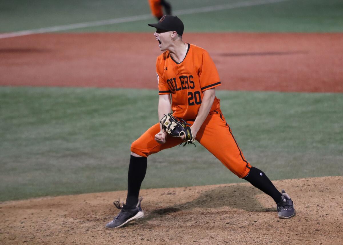 Huntington Beach pitcher Wyatt Thomas reacts to striking out the final batter against San Bernardino Aquinas on Thursday.