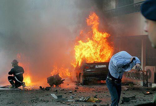 Flames leap from a car at the site of a bombing that killed Lebanese army Brig. Gen. Francois Hajj in Baabda, southeast of Beirut.