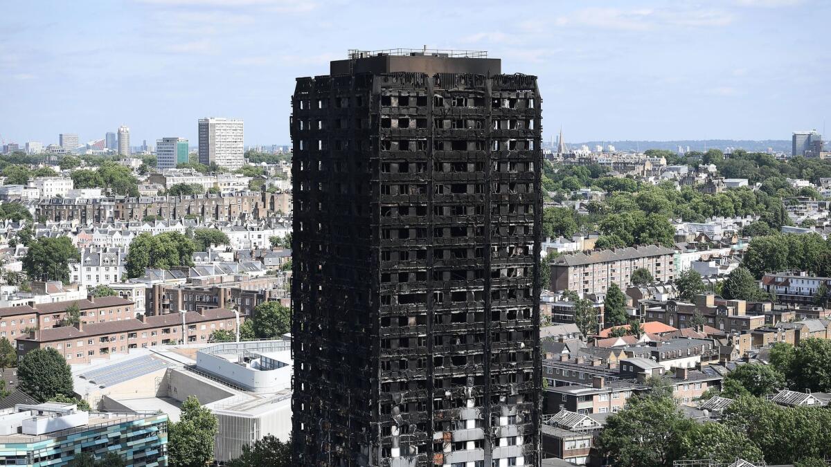 The remains of London's Grenfell Tower as seen from a neighboring tower block.