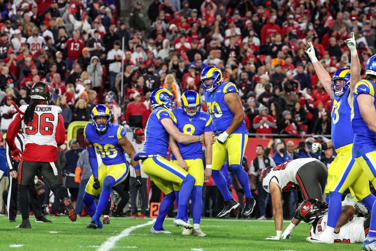 Rams kicker Matt Gay is mobbed by teammates after kicking his game-winning field goal against the Buccaneers on Sunday.
