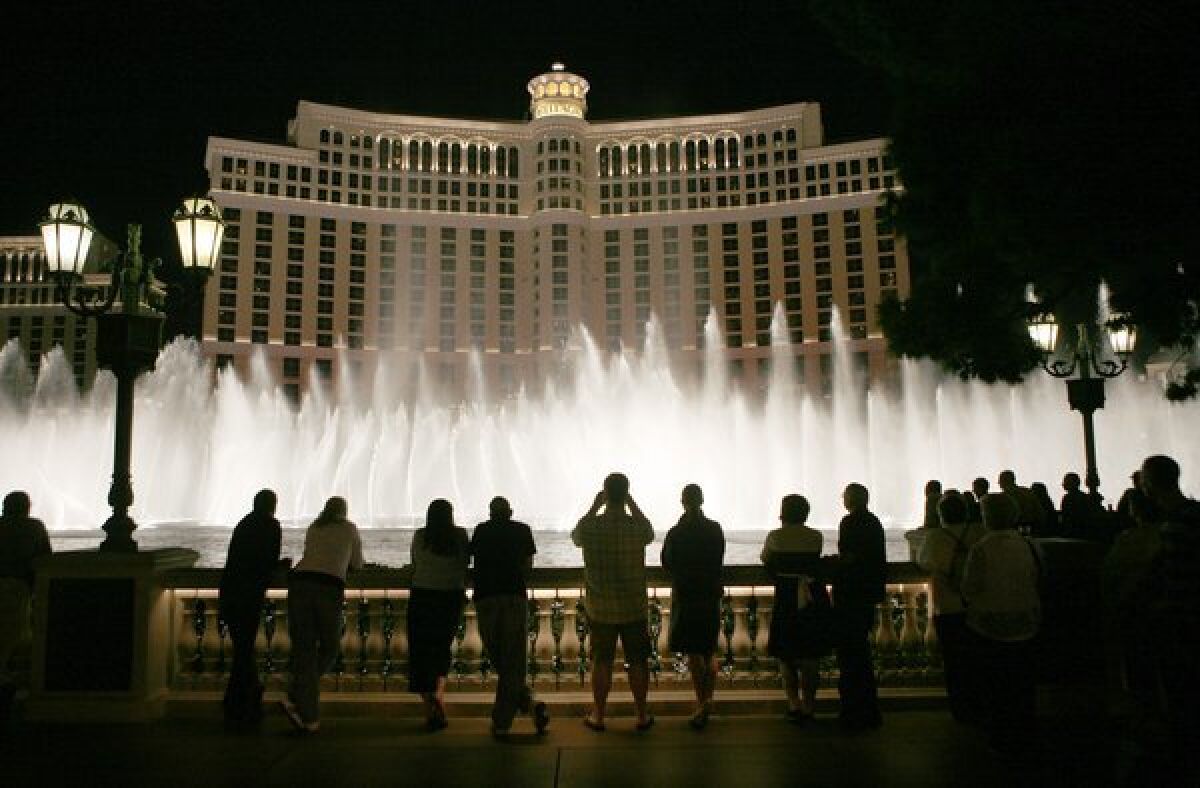 Tourists line up in front of the Bellagio in Las Vegas to watch the water show. An FBI affidavit says an undercover agent paid for Sen. Ronald Calderon (D-Montebello) to attend a Halloween party at the casino last year.
