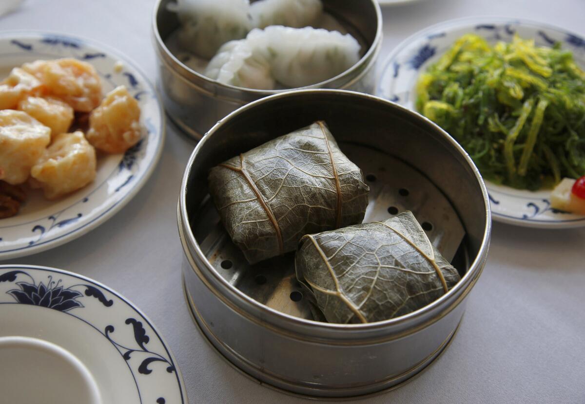Sticky rice with chicken and sausage, wrapped in a lotus leaf at Empress Pavilion in Chinatown.