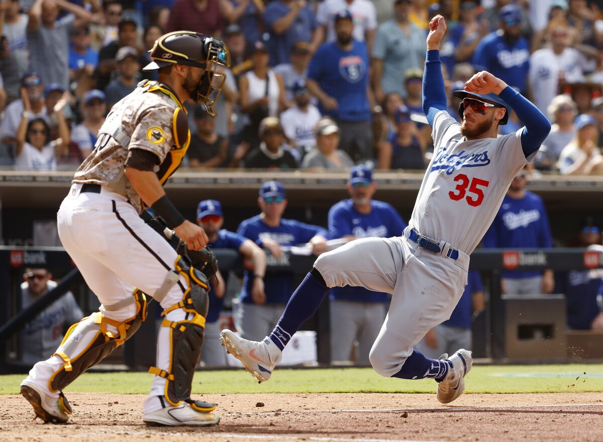 The Dodgers' Cody Bellinger scores on a single by Trea Turner on Sunday, September 11, 2022.