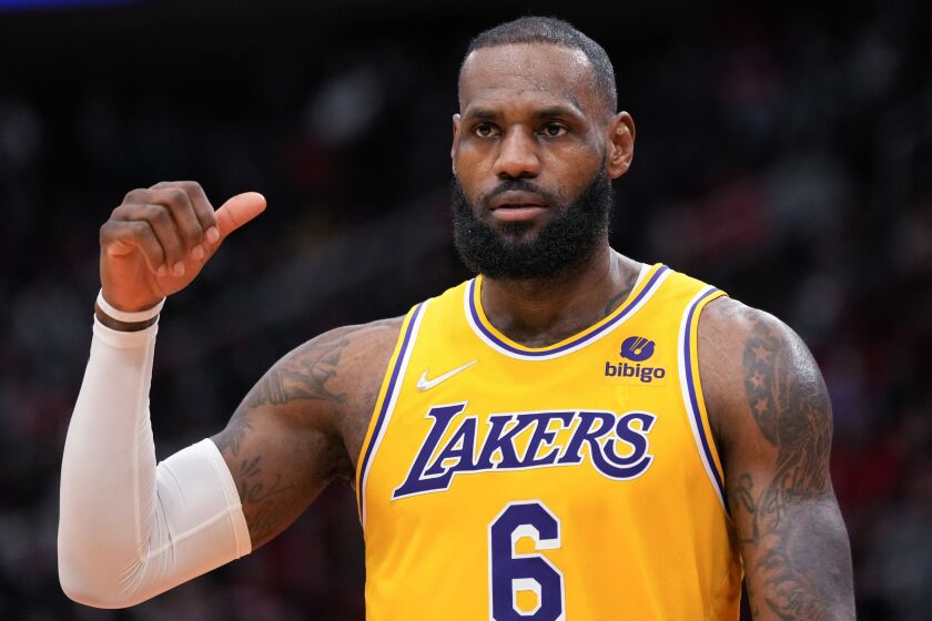 Los Angeles Lakers forward LeBron James reacts after blocking a shot by Houston Rockets forward David Nwaba during the second half of an NBA basketball game Tuesday, Dec. 28, 2021, in Houston. (AP Photo/Eric Christian Smith)