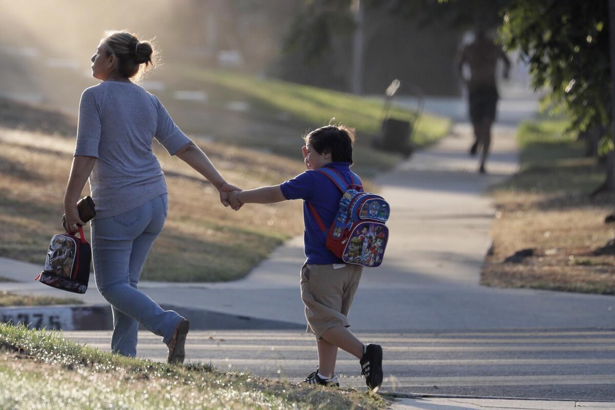 Students arrive at Baldwin Hills Elementary School for the first day of class for the Los Angeles Unified School District, the nation's second-largest school system.