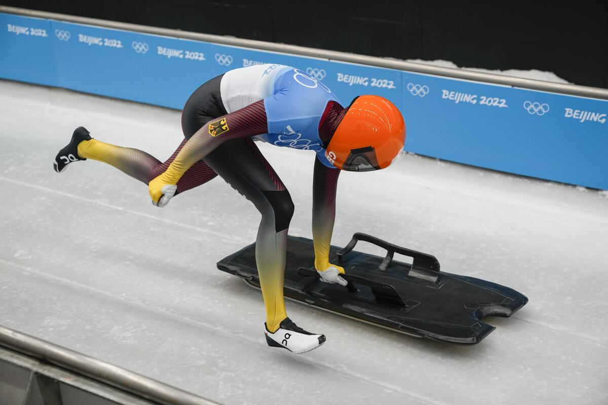 Hannah Neise runs to start the women's skeleton at the 2022 Olympics