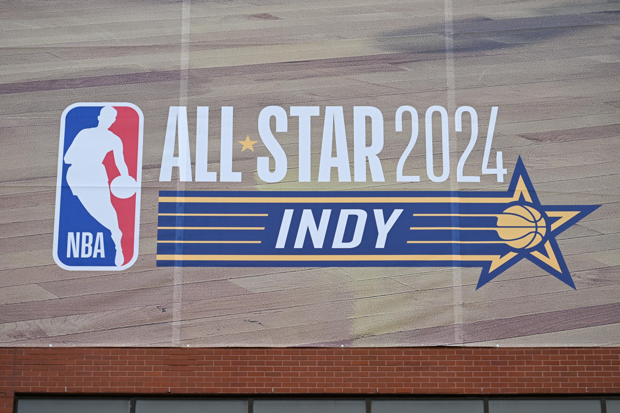 NBA All-Star Game signage is displayed on the side of a building in Indianapolis.