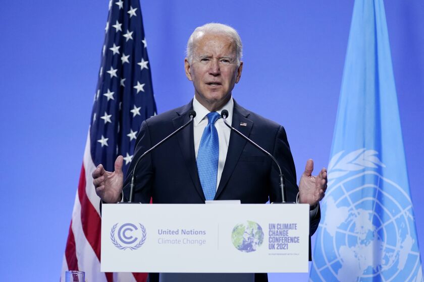 FILE - President Joe Biden speaks during a news conference at the COP26 U.N. Climate Summit, Nov. 2, 2021, in Glasgow, Scotland. Shortly after Biden took office, he issued what was widely hailed as a landmark executive order calling for the U.S. government to address the impact of climate change on migration. Since then, however, the Biden administration has done little more than study the idea. (AP Photo/Evan Vucci, File)