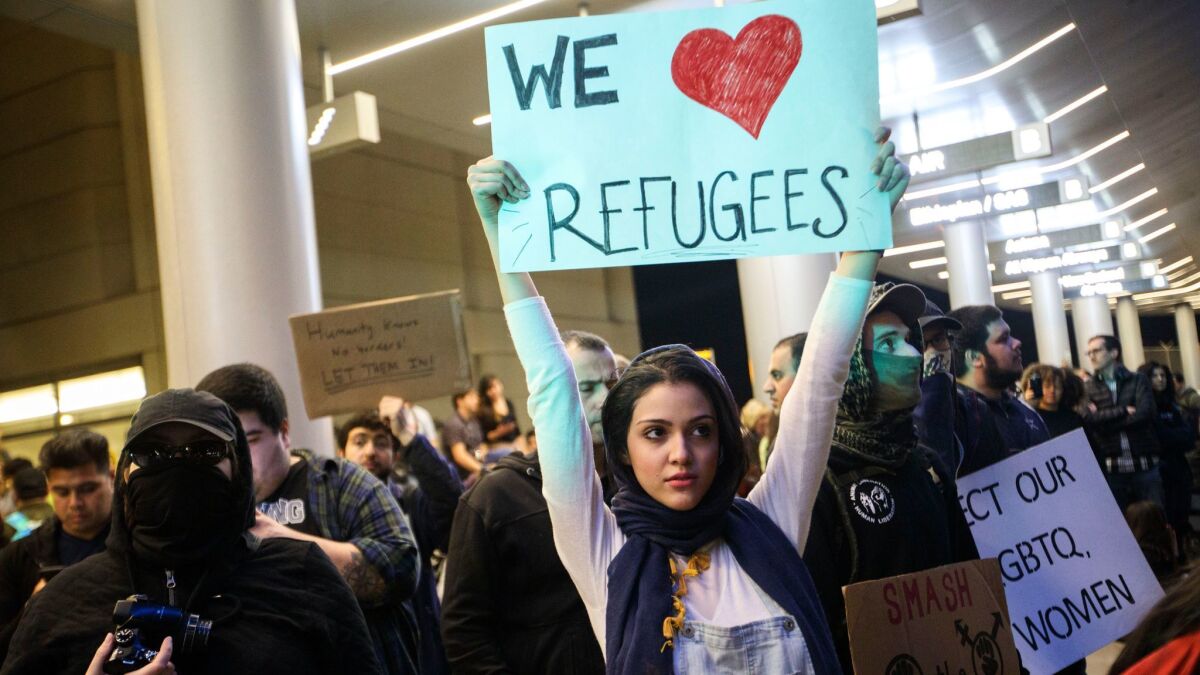 Protesters gather in front of the Tom Bradley International Terminal at Los Angeles International Airport after President Trump halted travel from seven Muslim-majority countries.