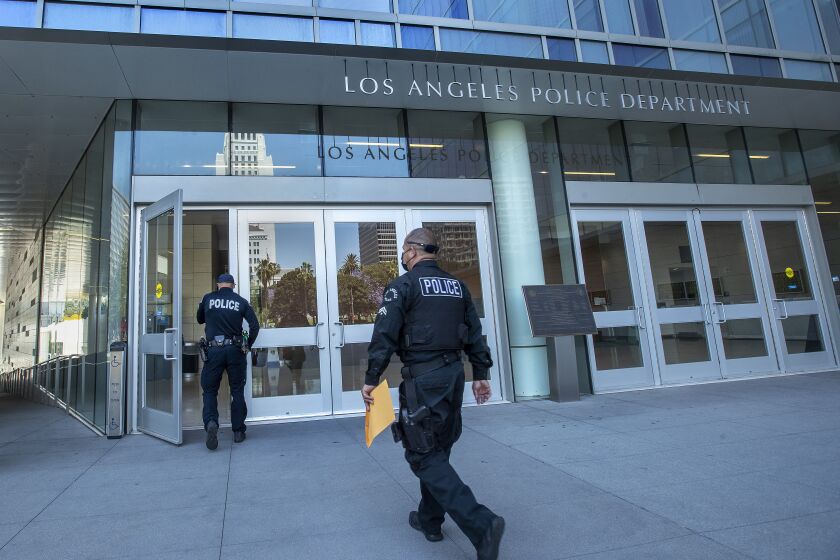 LOS ANGELES, CA - JUNE 03, 2021: Members of the LAPD make their way into LAPD Headquarters on 1st St. in downtown Los Angeles. (Mel Melcon / Los Angeles Times)