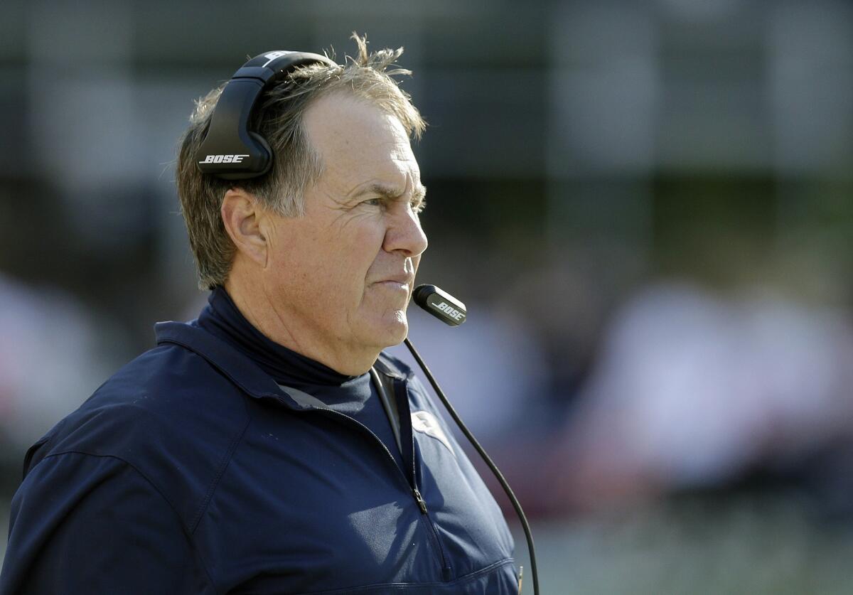 New England Patriots Coach Bill Belichick looks on from the sideline during the first half of a game against the Washington Redskins on Nov. 8.