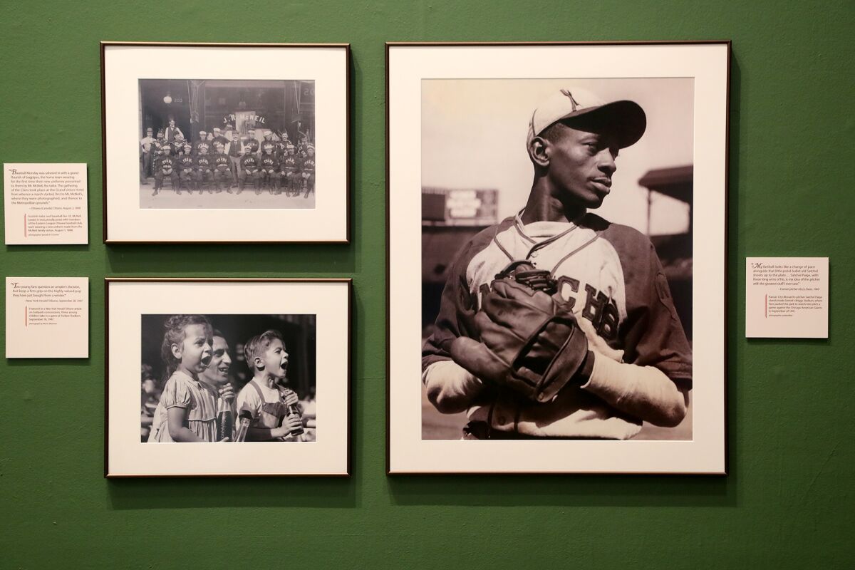 Vintage photographs include one of Kansas City Monarchs pitcher Satchel Paige in September 1941.