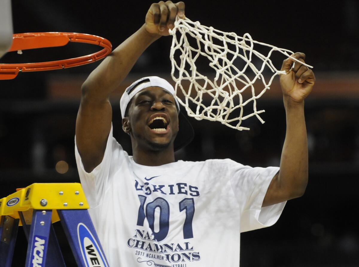 Kemba Walker cuts the final string of the net after leading UConn to the 2011 NCAA tournament title.