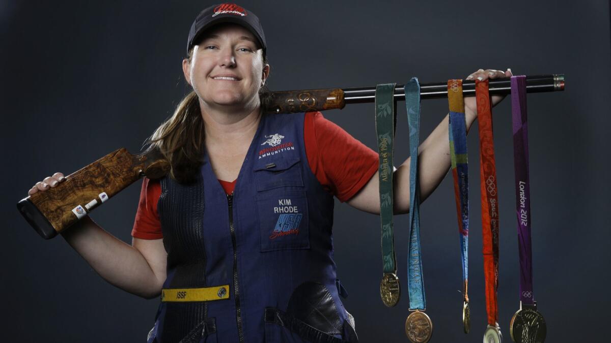 Kim Rhode poses with her Olympic medals at the 2016 Team USA media summit in Beverly Hills.