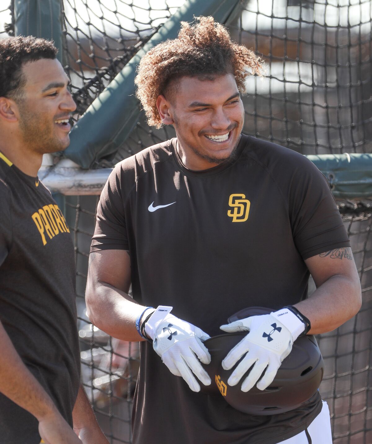 Padres outfielder Josh Naylor smiles during batting practice Friday at the Peoria Sports Complex.