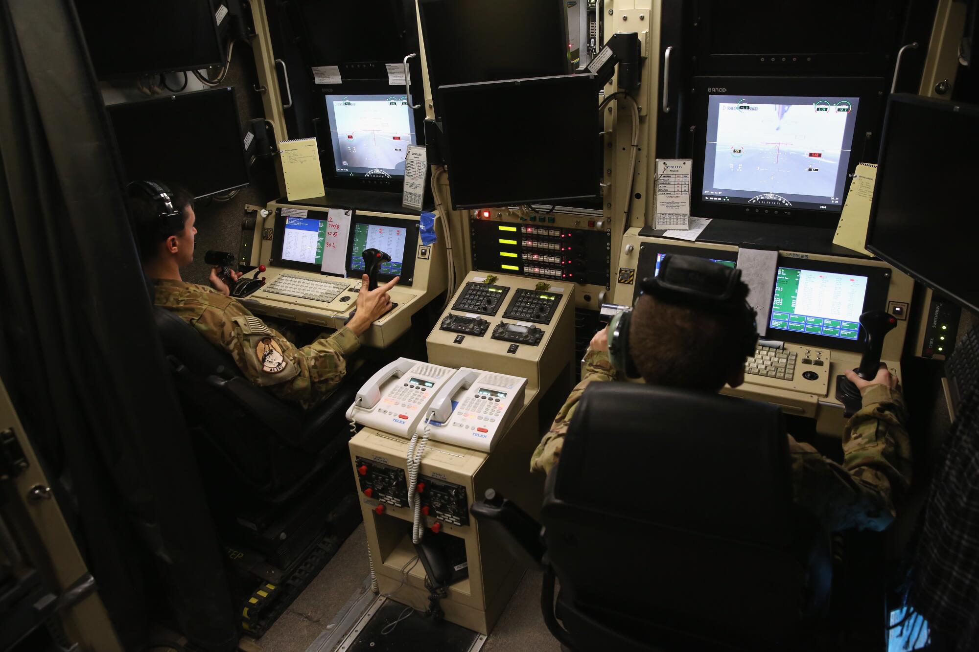 U.S. Air Force pilot and a censor operator prepare to launch a MQ-1B Predator unmanned aerial vehicle 