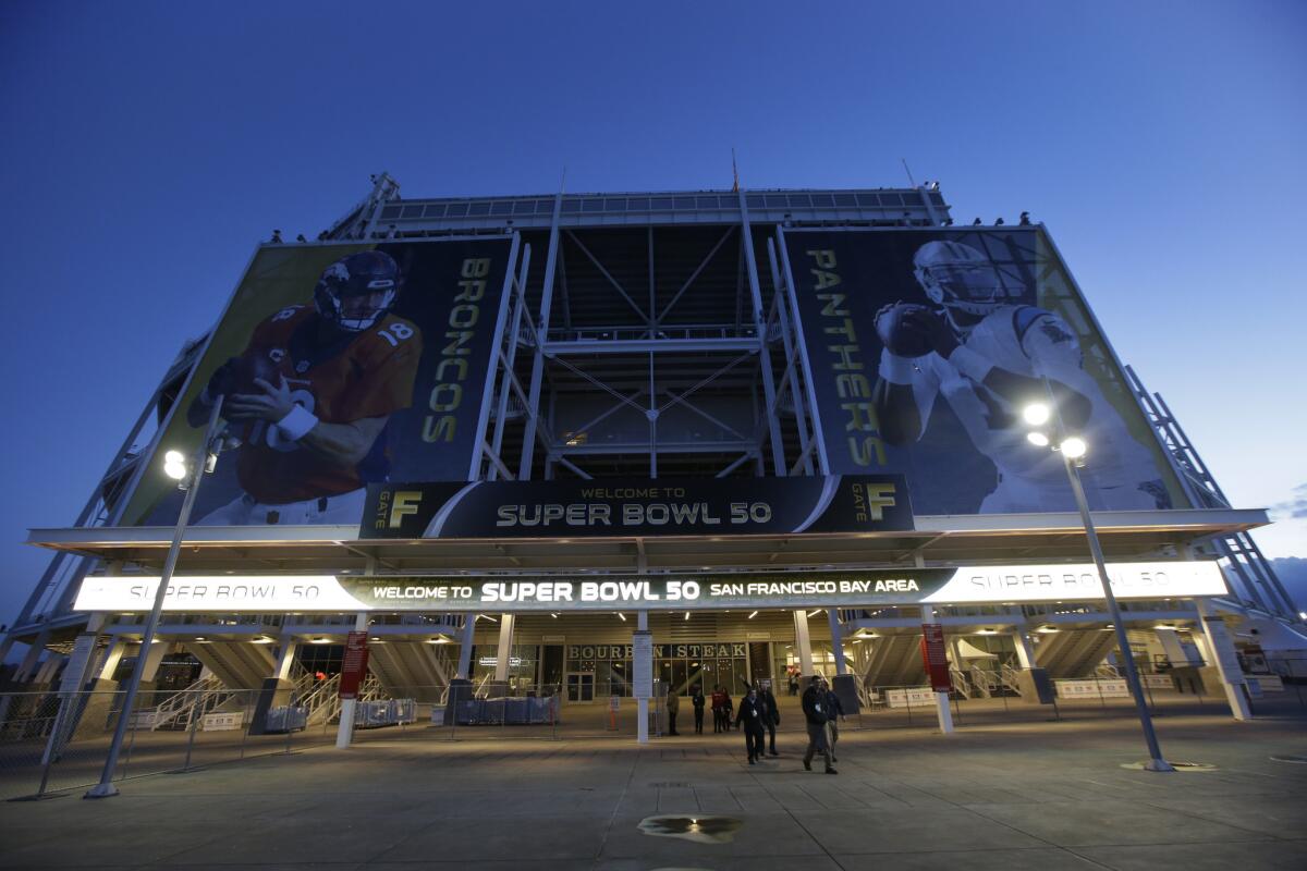 The entrance to Levi's Stadium is decorated with images of Denver Broncos quarterback Peyton Manning, left, and Carolina Panthers quarterback Cam Newton in Santa Clara, Calif.