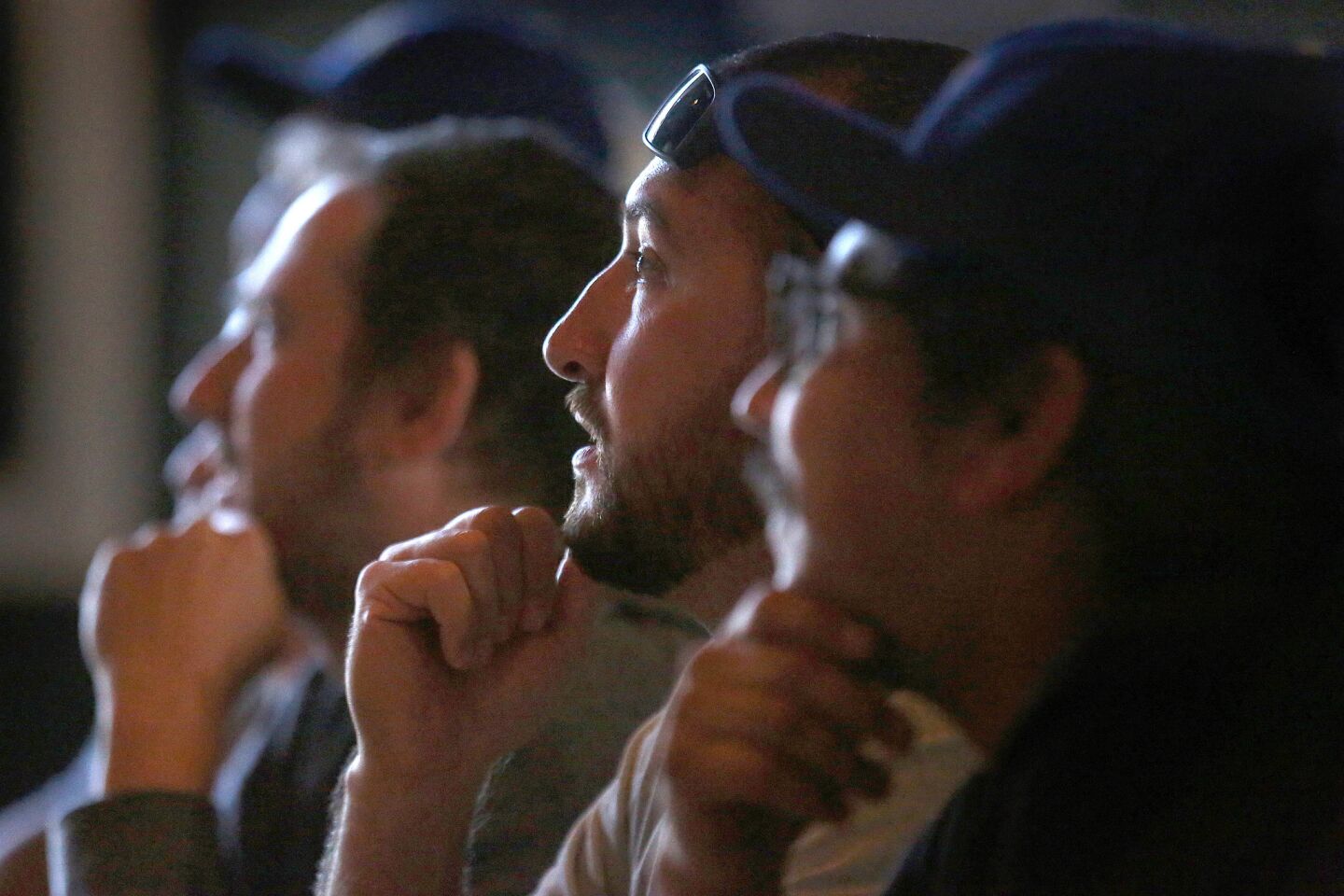 Geroge Montejano, 33, of South Pasadena, center, watches the game at the Greyhound Bar & Grill.