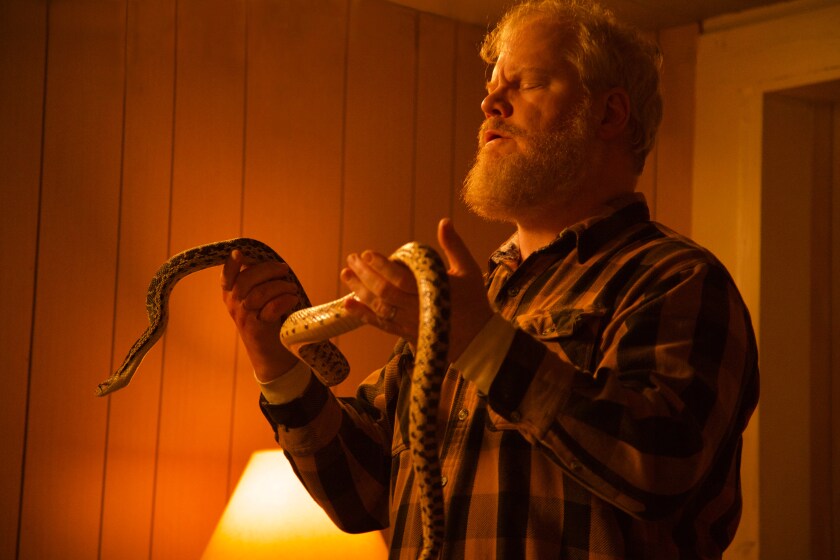 Jim Gaffigan handles a snake in a scene from "Them That Follow."