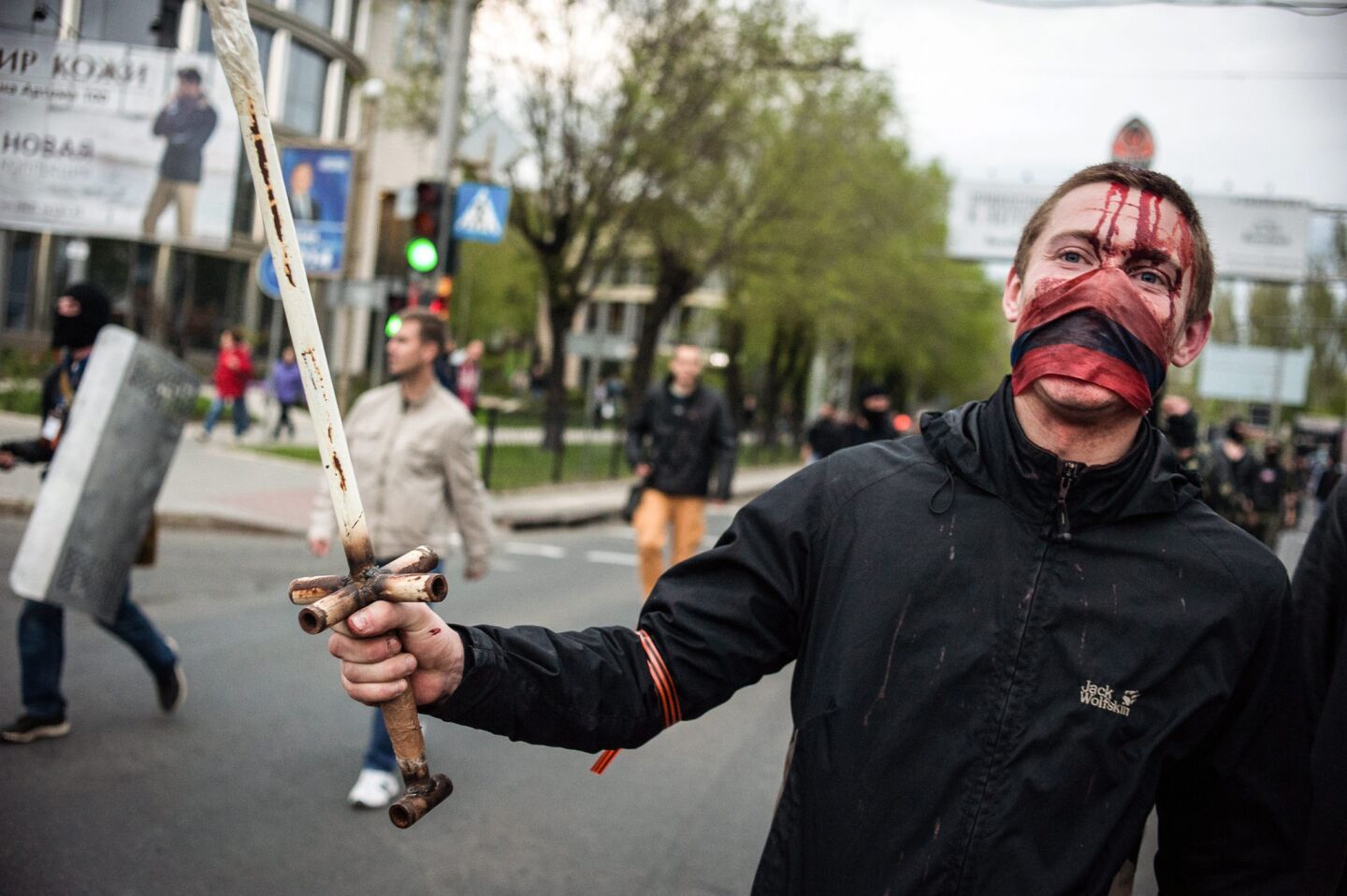 Pro-Russian protesters attack pro-Ukrainian supporters during their rally in Donetsk, Ukraine.