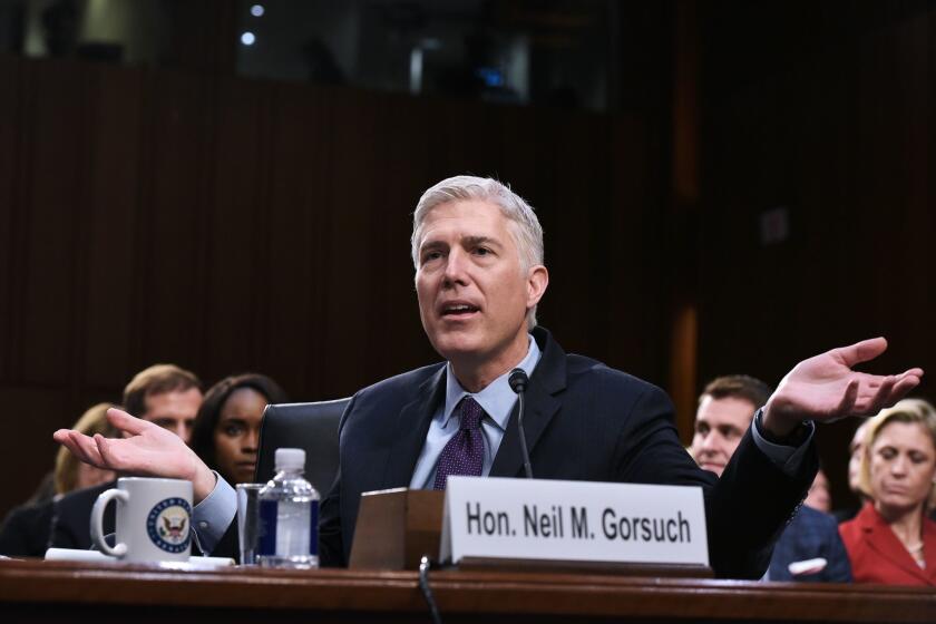 (FILES) This file photo taken on March 21, 2017 shows Neil Gorsuch as he testifies before the Senate Judiciary Committee on his nomination to be an associate justice of the US Supreme Court during a hearing in Washington, DC. Senate Democrats are mounting a filibuster of US President Donald Trump's Supreme Court pick, a rare obstruction of high-court appointments. If the gambit proves successful this coming week, Republicans will likely go nuclear. The Senate faces an epic showdown beginning April 3, 2017 over whether to confirm Judge Neil Gorsuch. / AFP PHOTO / MANDEL NGANMANDEL NGAN/AFP/Getty Images ** OUTS - ELSENT, FPG, CM - OUTS * NM, PH, VA if sourced by CT, LA or MoD **
