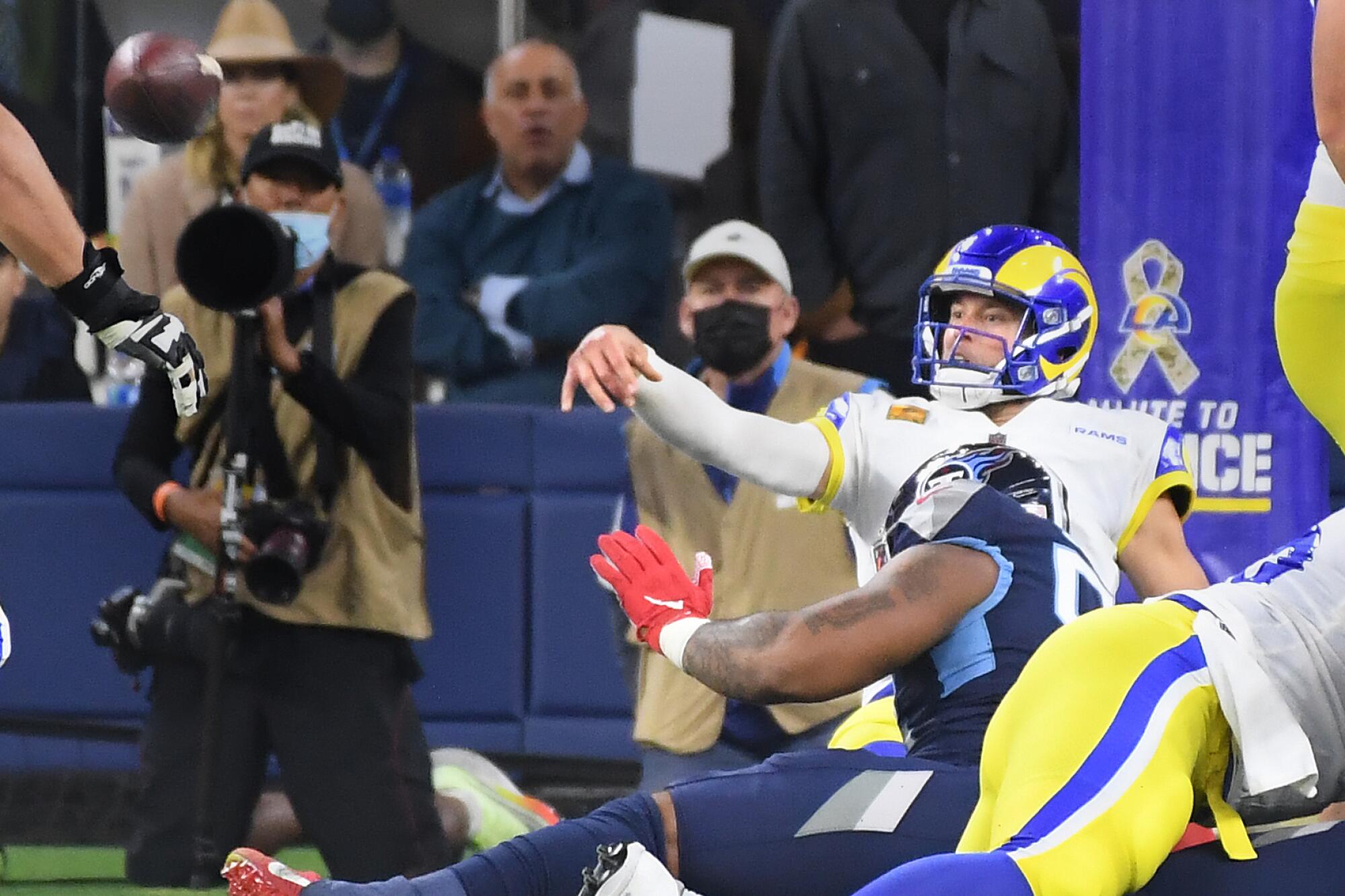 Rams quarterback Matthew Stafford throws an interception just before being brought down in the end zone.