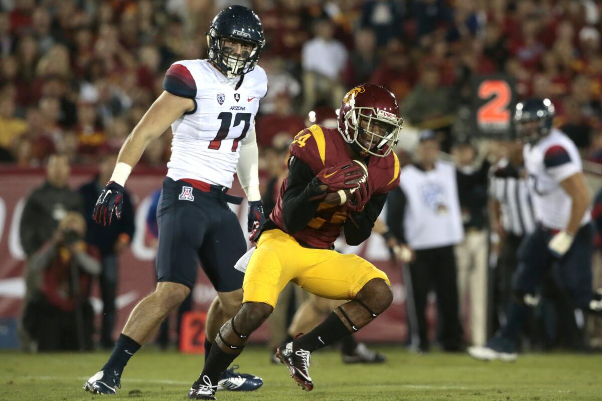 USC safety John Plattenburg intercepts a pass in front of Arizona receiver Josh Kern during the second quarter of a game on Nov. 7.