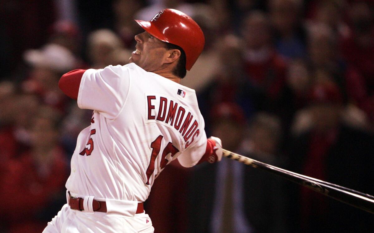 Jim Edmonds hits a home run with the St. Louis Cardinals in 2004.