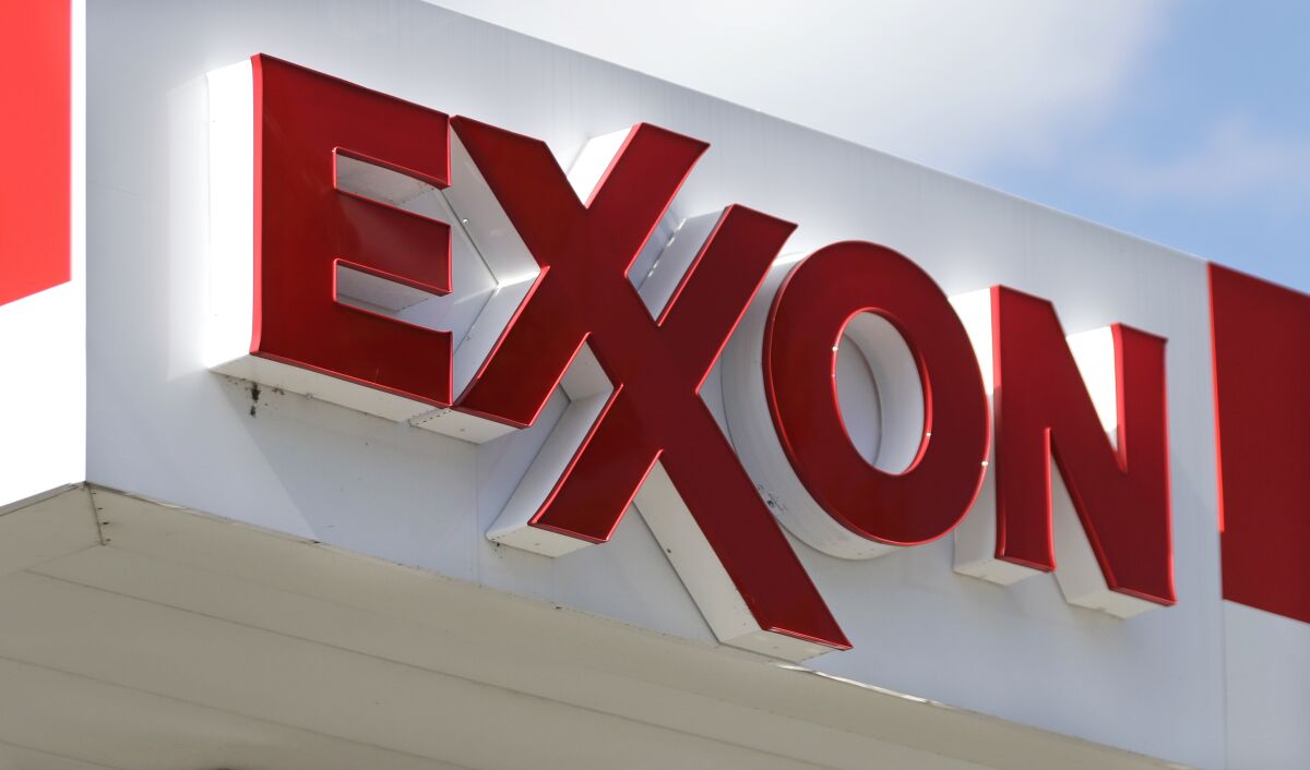 FILE- This April 25, 2017, file photo, shows an Exxon service station sign in Nashville, Tenn. Exxon Mobil Corp. on Tuesday, Feb. 1, 2022 reported fourth-quarter earnings of $8.87 billion. (AP Photo/Mark Humphrey, File)