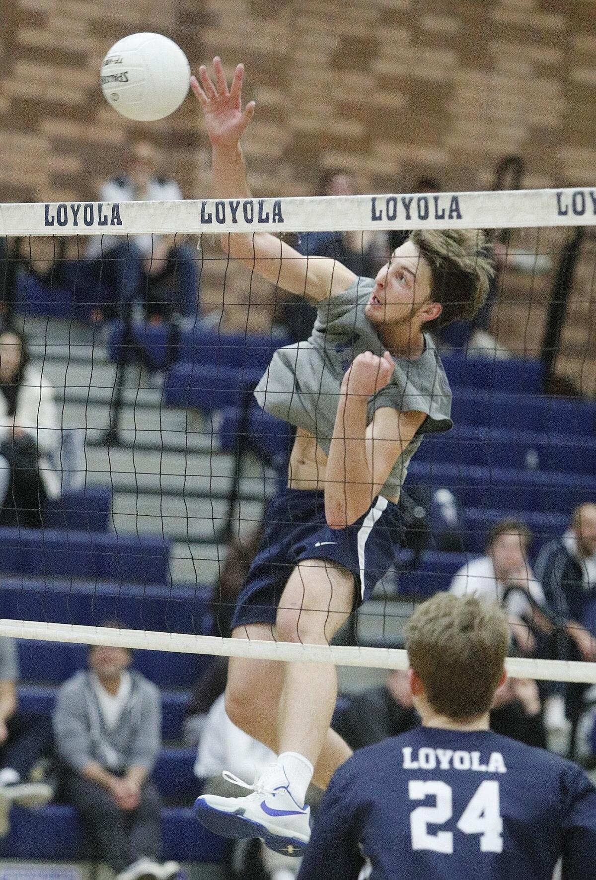 Corona del Mar High's Glen Linden hits a kill in a nonleague match at Loyola on Wednesday.