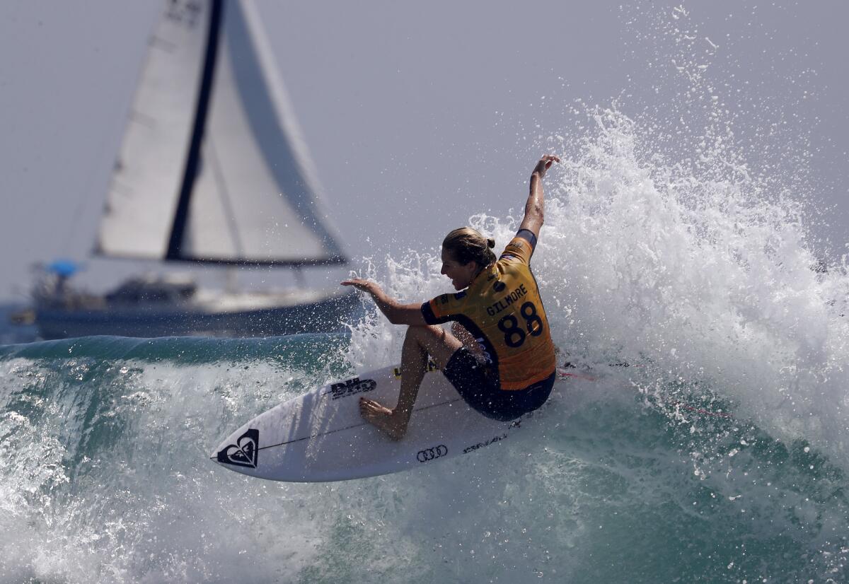 HUNTINGTON BEACH, CALIF. - AUG. 5, 2018. Stephanie Gilmore competes against Courtney Conlogue in the women's finals of the 2018 Vans U.S, Open of Surfing on Sunday, Aug. 5, 2018, in Huntington Beach. (Luis Sinco/Los Angeles Times)