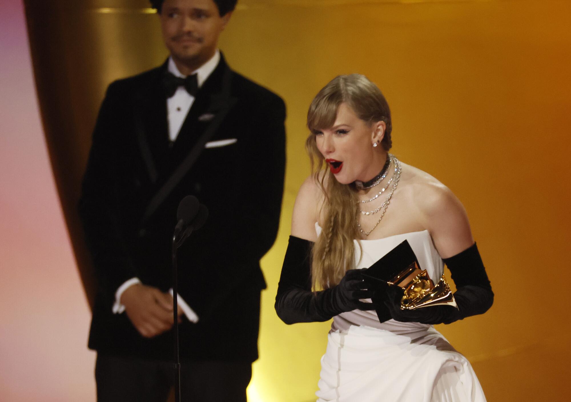 Taylor Swift accepts the Grammy for pop vocal album — and announces her next one.