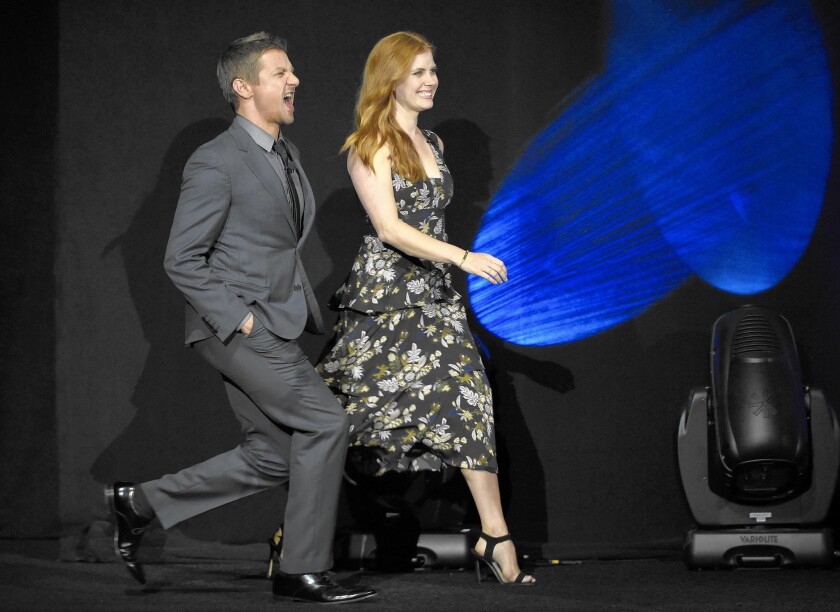 Actors Jeremy Renner, left, and Amy Adams, who star in the film “Story of Your Life,” appear Monday during Paramount Pictures’ CinemaCon presentation.