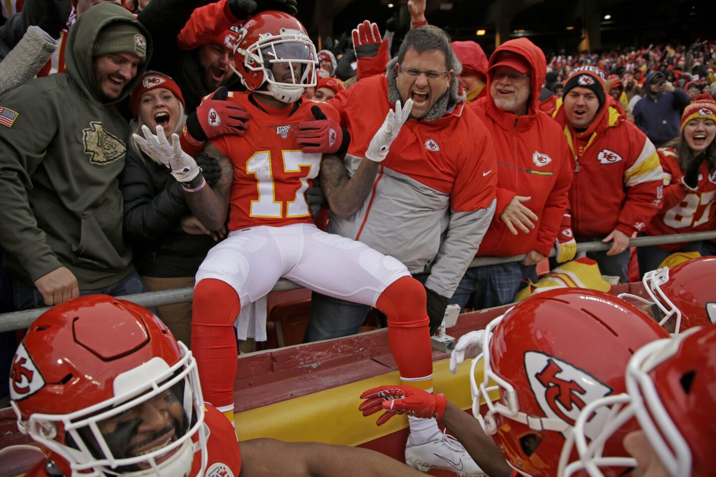 Chiefs receiver Mecole Hardman (17) celebrates his 104 yard kick return for a touchdown with fans and teammates during the second half of a game against the Chargers on Dec. 29.