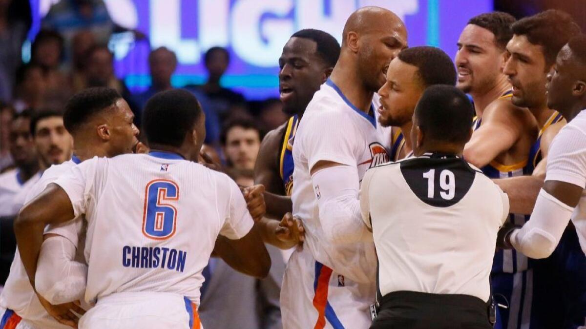 Thunder guard Russell Westbrook and guard Semaj Christon (6), Golden State Warriors forward Draymond Green, Thunder forward Taj Gibson, and Warriors guards Stephen Curry and Klay Thompson get into a tussle during the second quarter on March 20.