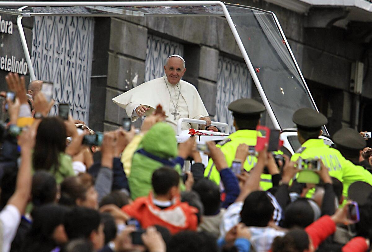 Pope Francis is welcomed by the crowd as he arrives at the Church and Convent of St. Francis to meet representatives of Ecuadoran civil society in Quito, Ecuador. Pope Francis is in Ecuador as part of his Latin America tour.