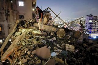 A man inspects a destroyed building that was hit by an Israeli airstrike in the southern suburbs of Beirut, Lebanon, Tuesday, July 30, 2024. An Israeli airstrike hit Hezbollah's stronghold south of Beirut Tuesday evening causing damage, a Hezbollah official and the group's TV station said. (AP Photo/Hussein Malla)