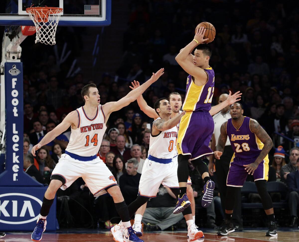 Jeremy Lin looks to pass against the Knicks defense during a game against New York on Feb. 1. at Madison Square Garden.