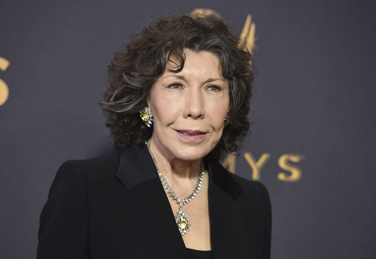 FILE - Lily Tomlin appears at the 69th Primetime Emmy Awards in Los Angeles on Sept. 17, 2017. Tomlin is this year's recipient of AARP The Magazine’s Movies for Grownups® Awards Career Achievement Award. The 20th anniversary virtual event, hosted by Alan Cumming, will be telecast on “Great Performances” on PBS on March 18 . (Photo by Jordan Strauss/Invision/AP, File)