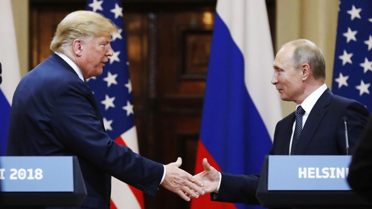 President Trump with Russian President Vladimir Putin at their summit in Helsinki, Finland. The White House says that Trump would be open to a meeting in Moscow next year.
