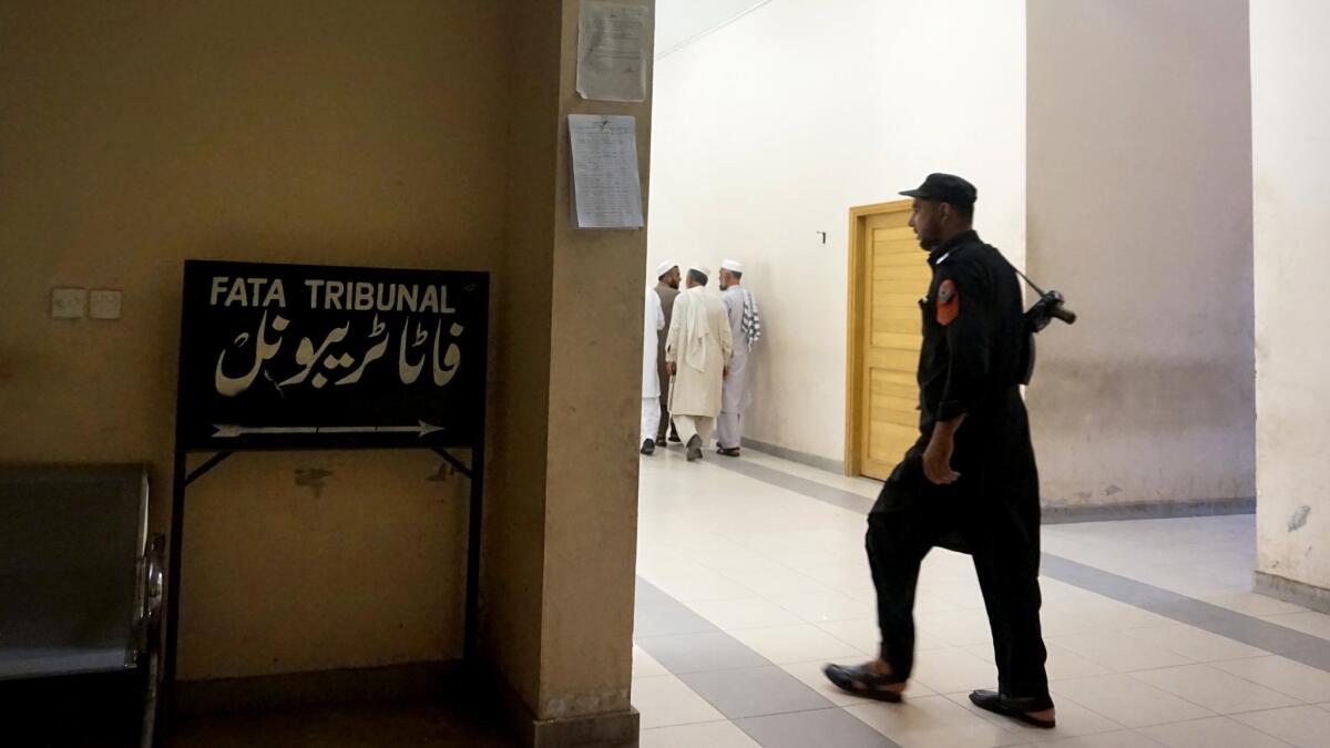 A tribal security officer keeps watch at the FATA Tribunal.