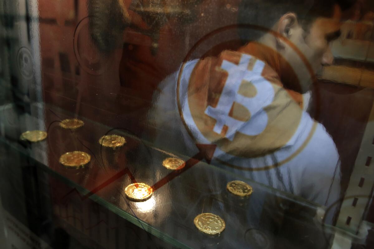Coins next to the Bitcoin logo.