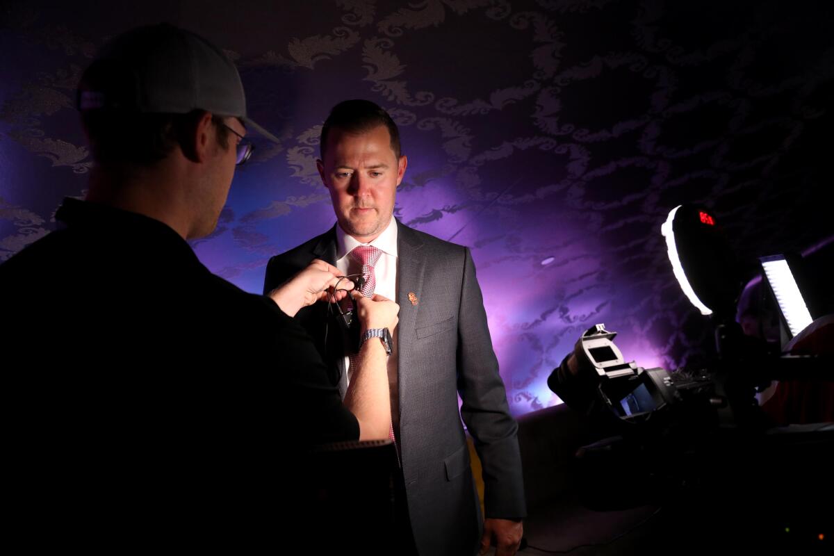 USC coach Lincoln Riley finishes an interview during Pac-12 media day.